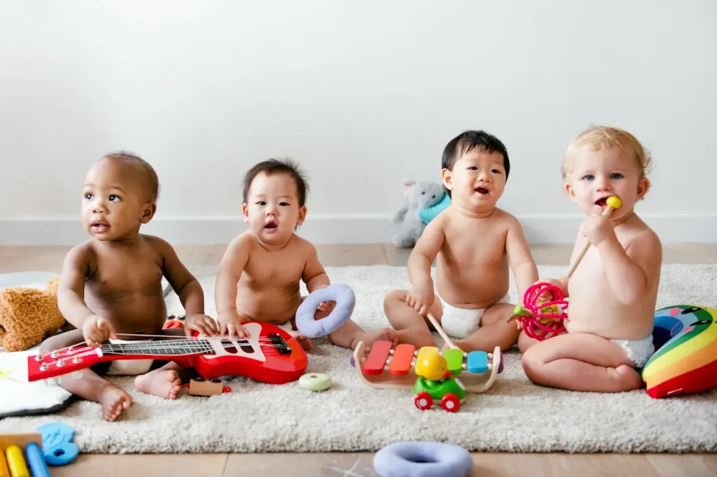4 Babies on the Mat Playing 