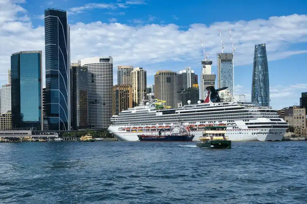 A Large Cruise Ship Docks in the City Bay