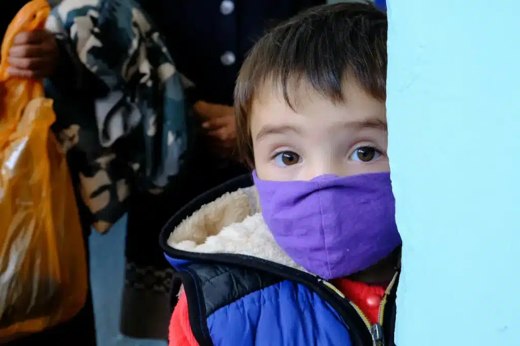 A Little Boy Wearing a Mask