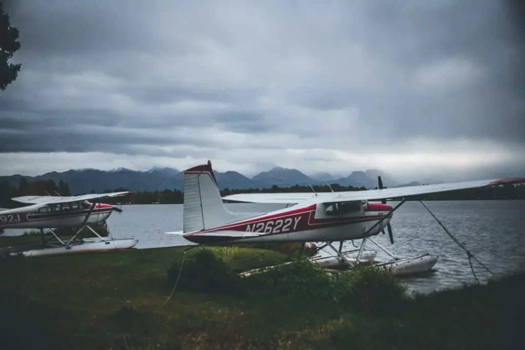 A Small Plane Sitting on Top of a Lush Green Field 