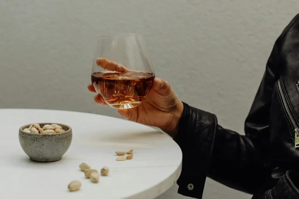 A Woman Holding a Whisky