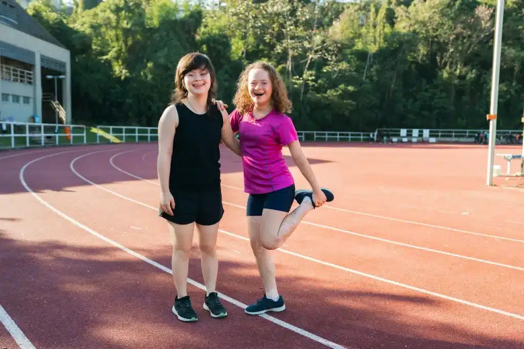 Two Kids Standing on the Tennis Court