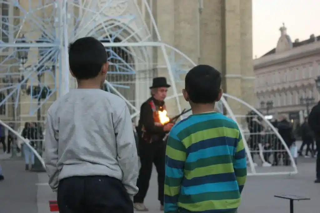 Two Young Children Watching the Magician 