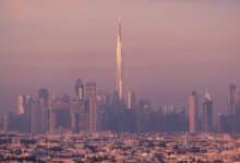 Mesmerizing dusk view of Dubai skyline with the iconic Burj Khalifa towering above the city.
