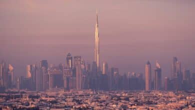 Mesmerizing dusk view of Dubai skyline with the iconic Burj Khalifa towering above the city.