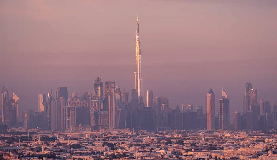 Mesmerizing dusk view of Dubai skyline with the iconic Burj Khalifa towering above the city.