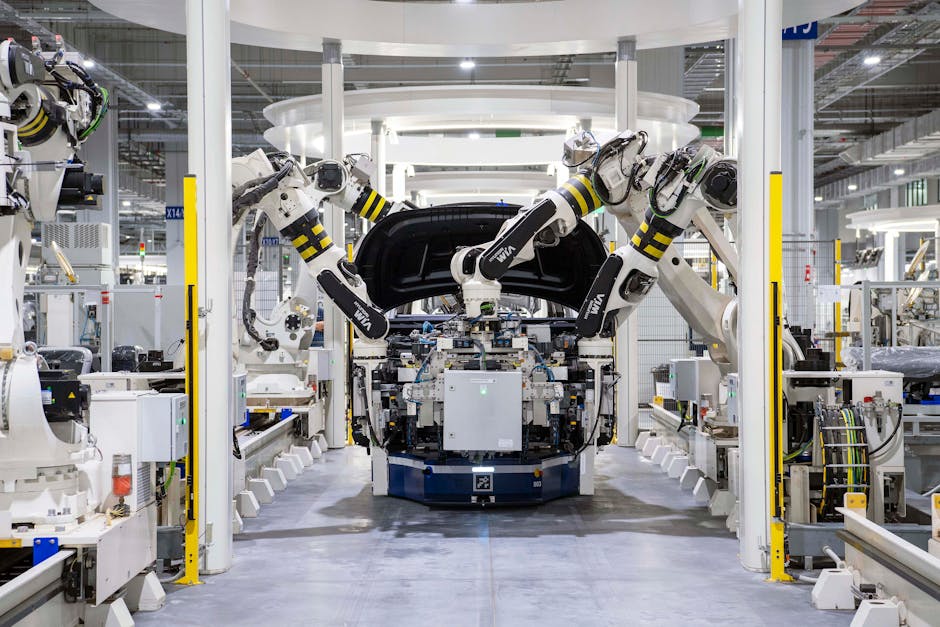 High-tech robots assembling a car in a modern factory setting showcasing automation.
