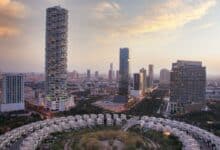 an aerial view of a city with tall buildings