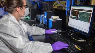 man in white dress shirt sitting in front of computer