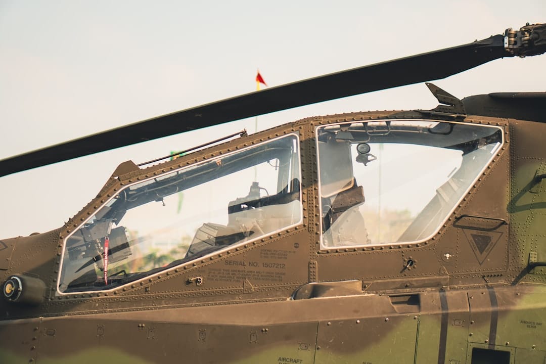 A close up of a military helicopter with its door open