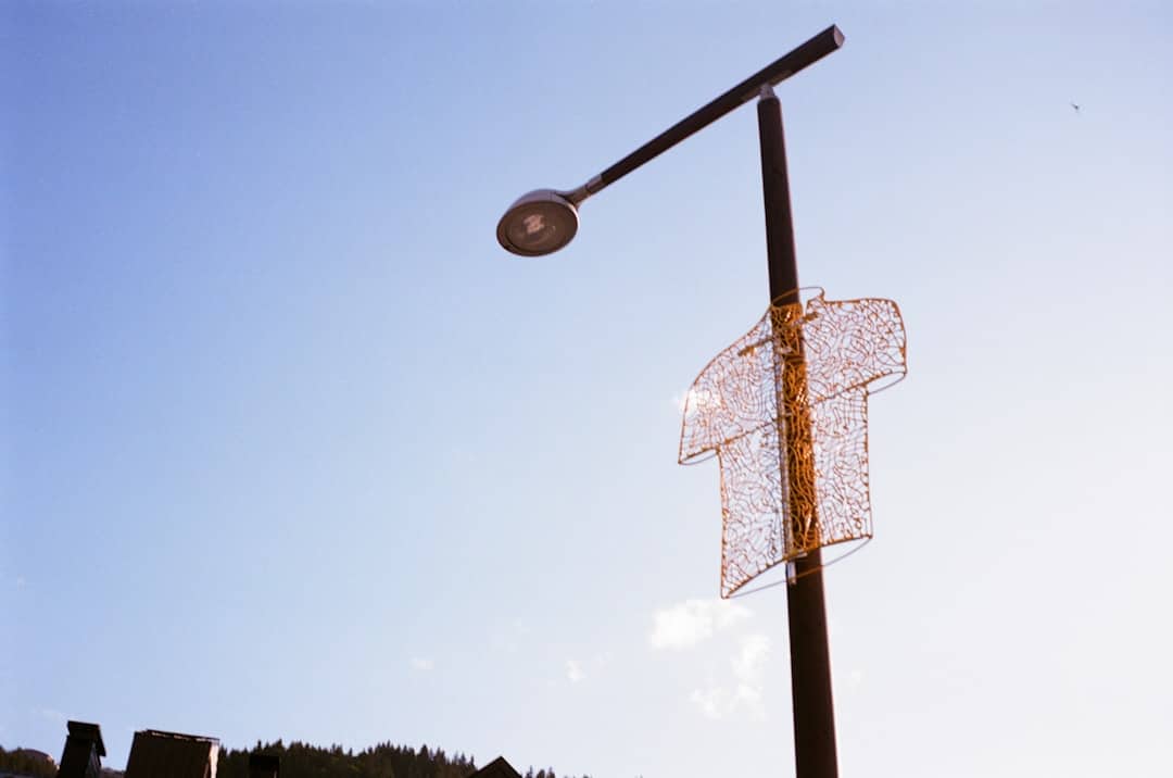 a street light with a piece of wire attached to it