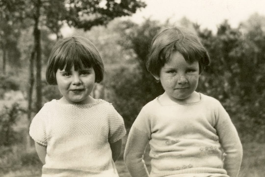 grayscale photo of 2 children