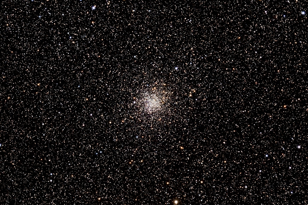 A dense star cluster in the night sky.
